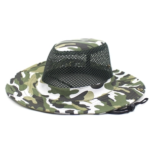Close-up of breathable green mesh panels and jungle camo brim on outdoor sun hat