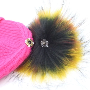 Magenta knitted beanie featuring a detachable multicolored faux fur pompom with metal snap