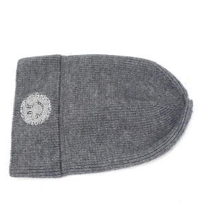 Dark grey ribbed knit beanie for women featuring an embroidered smiley face patch
