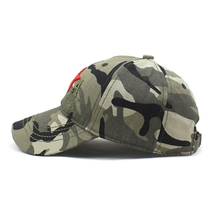 Detailed embroidery of a red star and air force letters on the camouflage baseball cap