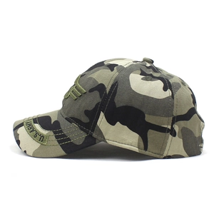 Detail of woodland camouflage baseball cap featuring embroidered U.S. ARMY side lettering