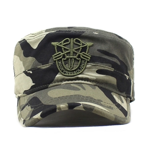 Macro detail of military camo patrol cap with embroidered special forces badge and motto