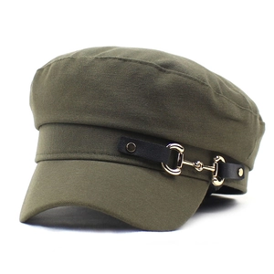 Detail of army green cotton baker boy hat featuring black strap and golden horsebit buckle
