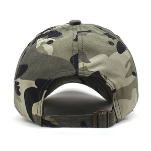 Detail view of the camouflage baseball cap showing canvas fabric and metal buckle