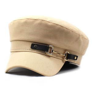 Detail of khaki cotton navy hat with black strap and golden horsebit metal buckle