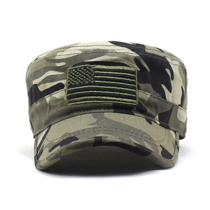 Detail of USA flag embroidery on woodland camouflage military flat top cadet cap