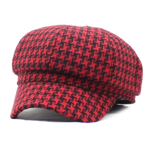 Classic red and black houndstooth newsboy cap for women featuring warm wool blend fabric