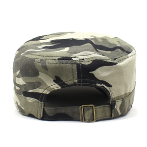 Detail of adjustable metal buckle and camouflage canvas texture on army cadet hat