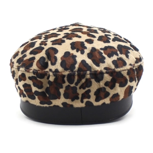 Detail of leopard print flat top hat with faux fur texture and black leather trim
