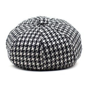 Classic black and white houndstooth newsboy cap with octagonal top for autumn and winter