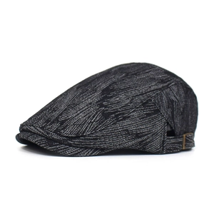 Detail view of cotton denim beret featuring herringbone texture and metal side buckle