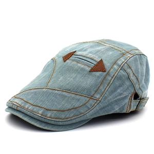 Vintage light blue washed denim flat cap with orange stitching and triangle patches