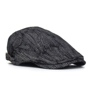 Detail view of the side buckle on a vintage dark grey textured flat cap for men and women