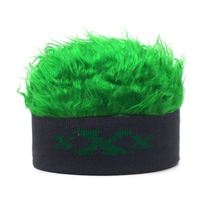 Close-up of funny knit beanie with bright green faux hair wig and XXX embroidery