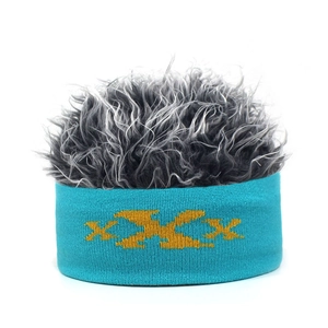 Detail of teal knit headband with yellow pattern and fluffy grey novelty wig hair