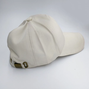 Classic cream cotton baseball cap with adjustable copper buckle and structured design