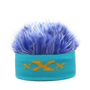 Detail of creative knit headband with funky blue wig hair and yellow pattern design