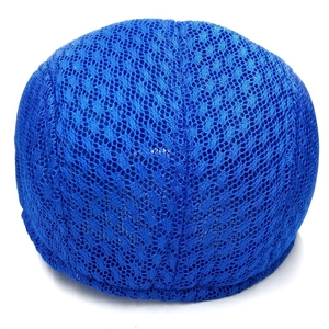 Close-up of royal blue breathable mesh fabric detail on a stylish summer beret cap