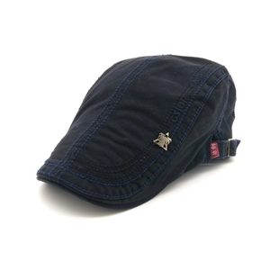 Men's navy cotton flat cap with metal eagle emblem and blue contrast stitching details