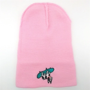 Pink knitted beanie hat for women featuring a cute Boston Terrier dog on a skateboard embroidery