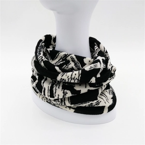 Women's autumn winter knit slouchy beanie and neck gaiter with black white graffiti pattern