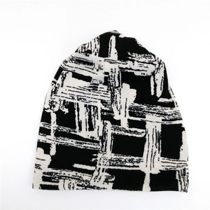 Chic black and white graffiti knit beanie hat for women with artistic abstract brush patterns