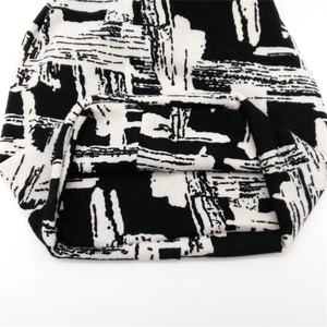 Women's autumn winter knit beanie hat featuring stylish black and white graffiti pattern
