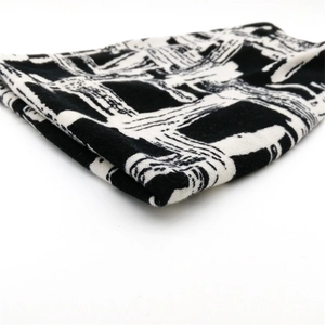 Modern black and white graffiti knit beanie hat with thick geometric pattern