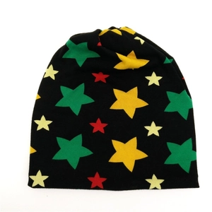 Knitted star pattern beanie hat for women in black cotton material on white background
