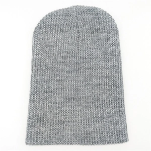 Detailed view of gray knit beanie showing soft textured fabric and elastic weave pattern