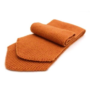Thick orange knit wool scarf for parents and kids with ribbed texture on white background