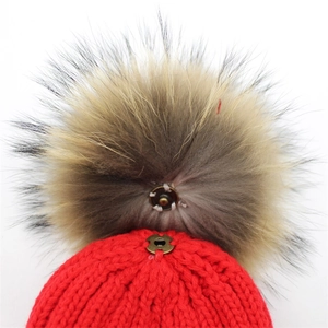 Winter red knitted beanie for women featuring a detachable fluffy fur pom-pom with snap button