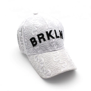White lace baseball cap with black BRKLN embroidery for outdoor sun protection