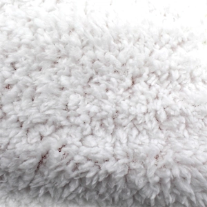 Close-up of white plush thermal fleece lining with dense texture for winter warmth