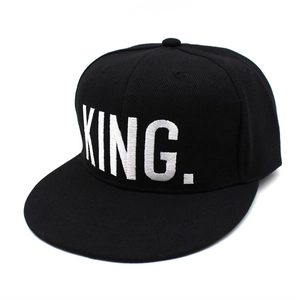 Classic black snapback baseball cap with white embroidered King text in front