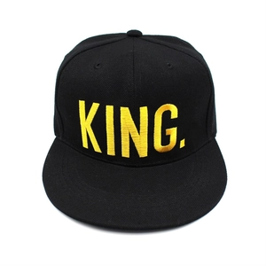 Classic black snapback baseball cap featuring yellow embroidered King text for men and women