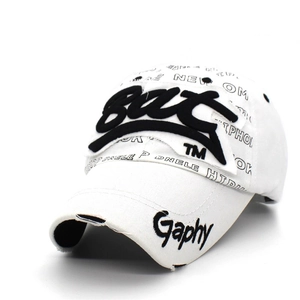 Close-up of 3D Bat embroidery and distressed brim on white graffiti baseball cap