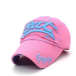 Close-up of pink cotton baseball cap with blue towel embroidery and distressed details