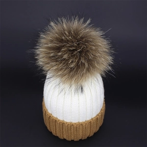 Winter two-tone knitted beanie with large faux fur pompom and ribbed cuff for women