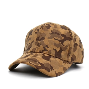 Close-up of camouflage baseball cap fabric with earthy tones and six-panel stitching