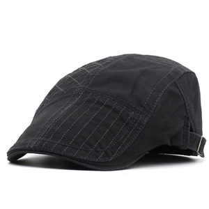 Detail view of cotton beret featuring cross-stitch texture and metal adjustment buckle