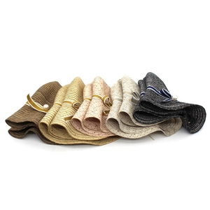Detailed weave of sun hats with elegant pearl accents and ribbons in various colors