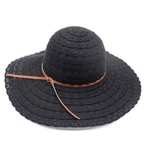 Elegant women's summer sun hat featuring wide brim black lace crochet and brown leather band