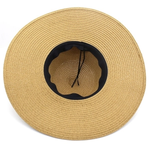 Women's wide brim straw sun hat with woven texture and internal adjustable strap for beach