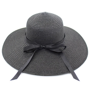 Elegant women's black wide brim straw sun hat with decorative silk ribbon bow