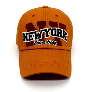 Orange baseball cap featuring NY NEW YORK 1946 embroidery in vintage American street style