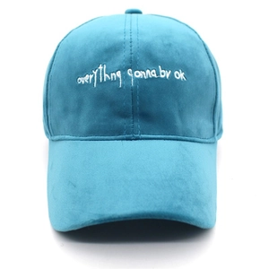 Blue suede-like velvet baseball cap with white embroidered text on white background