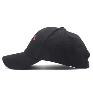 Detailed side view of a black baseball cap featuring red letter embroidery and curved brim