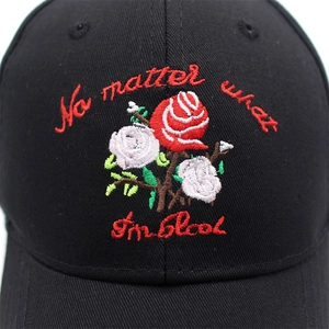 Women's black cotton baseball cap featuring detailed red and white rose floral embroidery