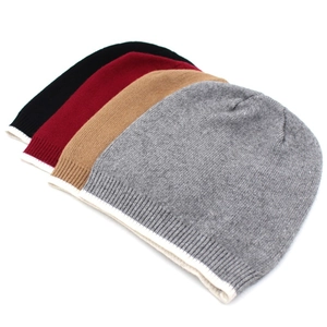 Detail showing soft knit texture and contrast white rolled cuffs in four classic colors